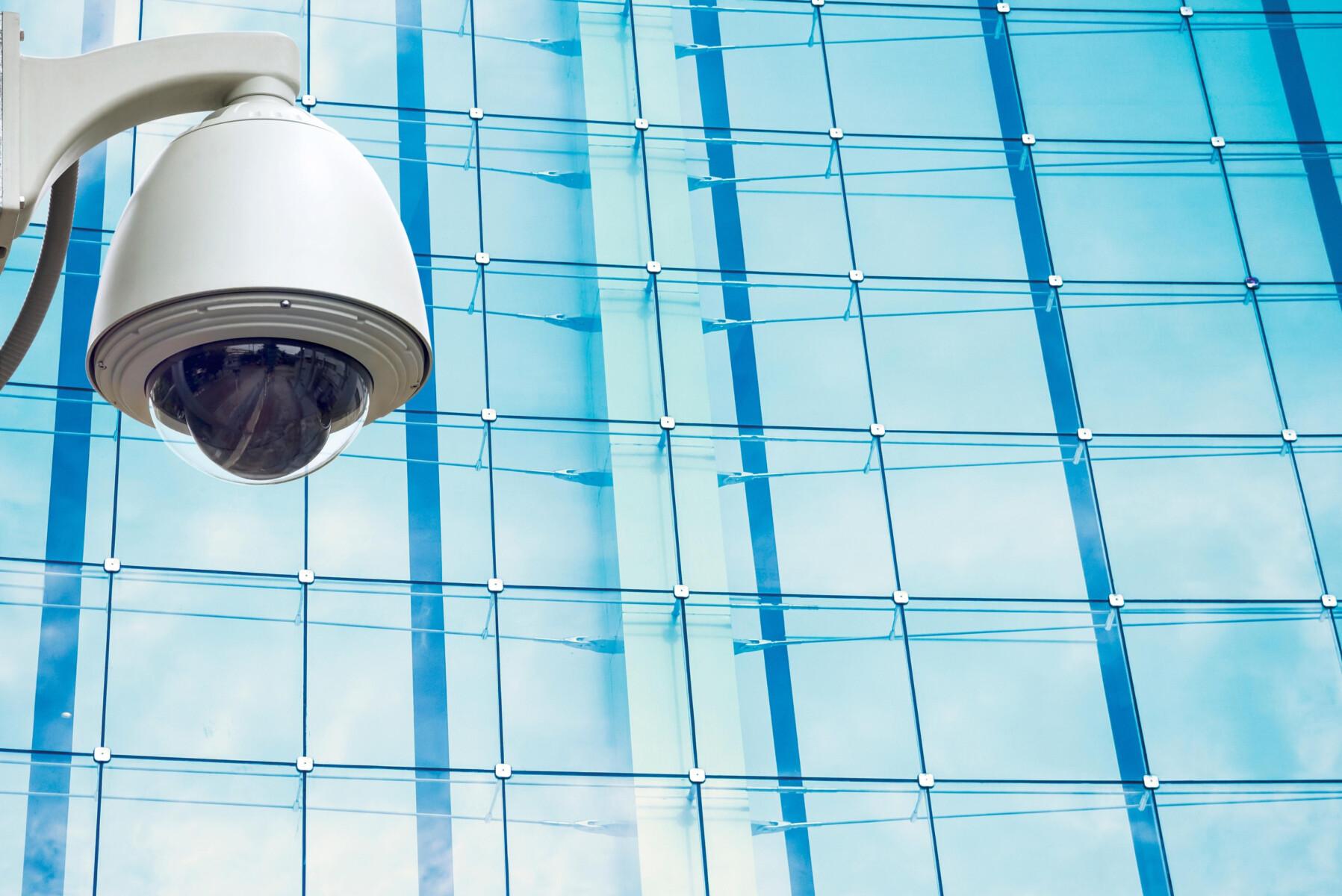 security camera against glass building facade duri 2026 03 13 05 53 39 utc